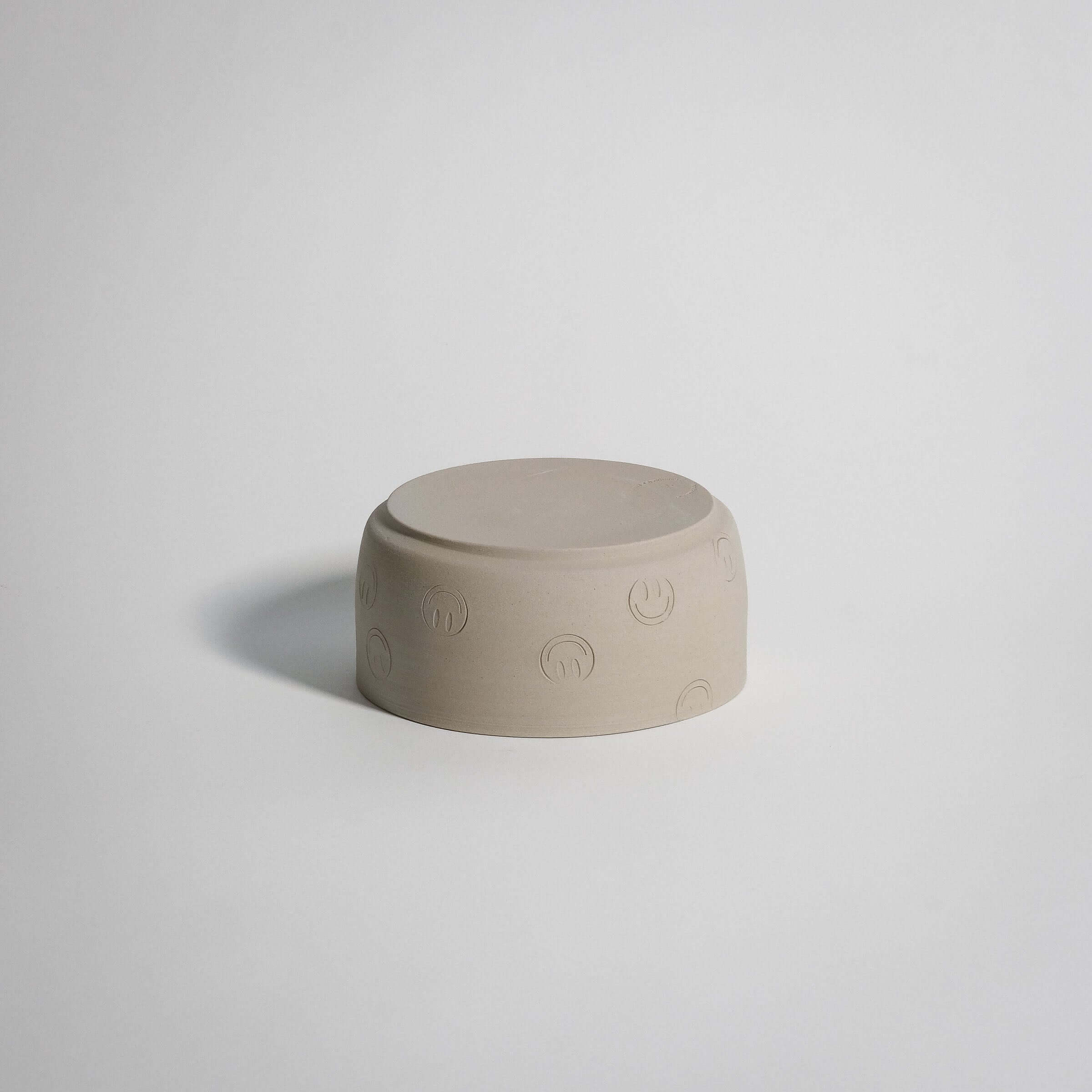 Smiley Breakfast Bowl in grey stoneware with happy face designs, perfect for soup, granola, or pasta.