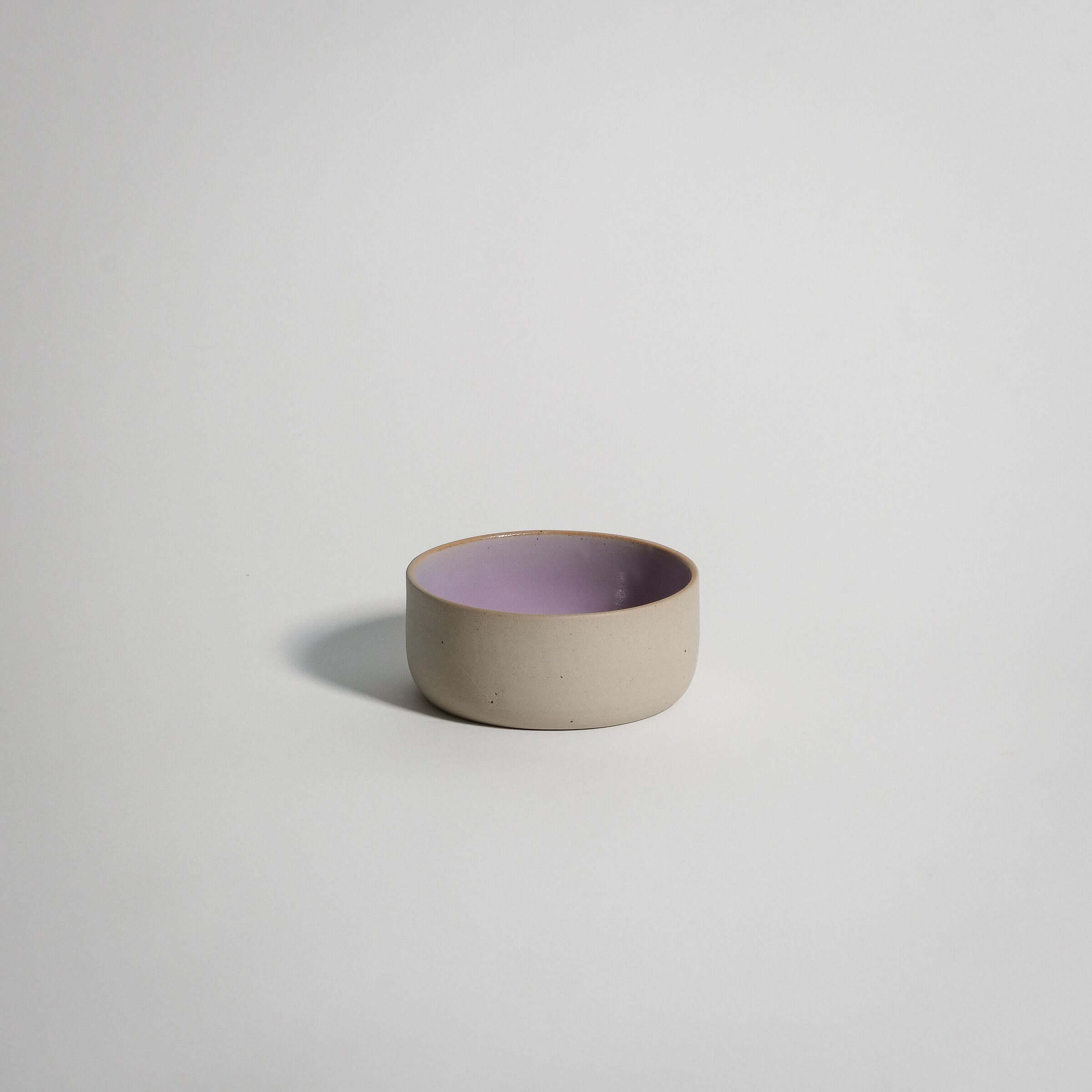 Handcrafted pink stoneware snack bowl with glossy glaze, perfect for snacks and everyday use.