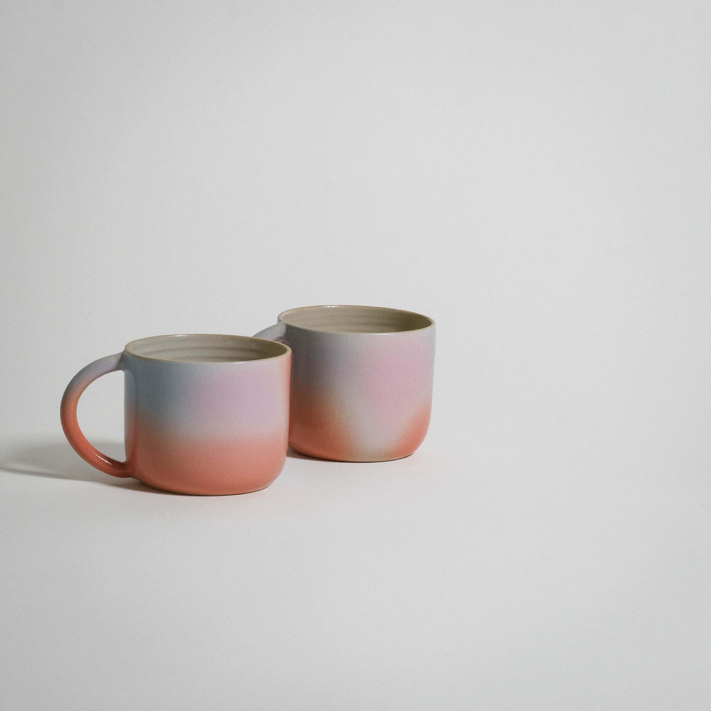 Dawn Variation Mug set in grey stoneware with orange, blue, pink glaze, perfect for coffee or tea.