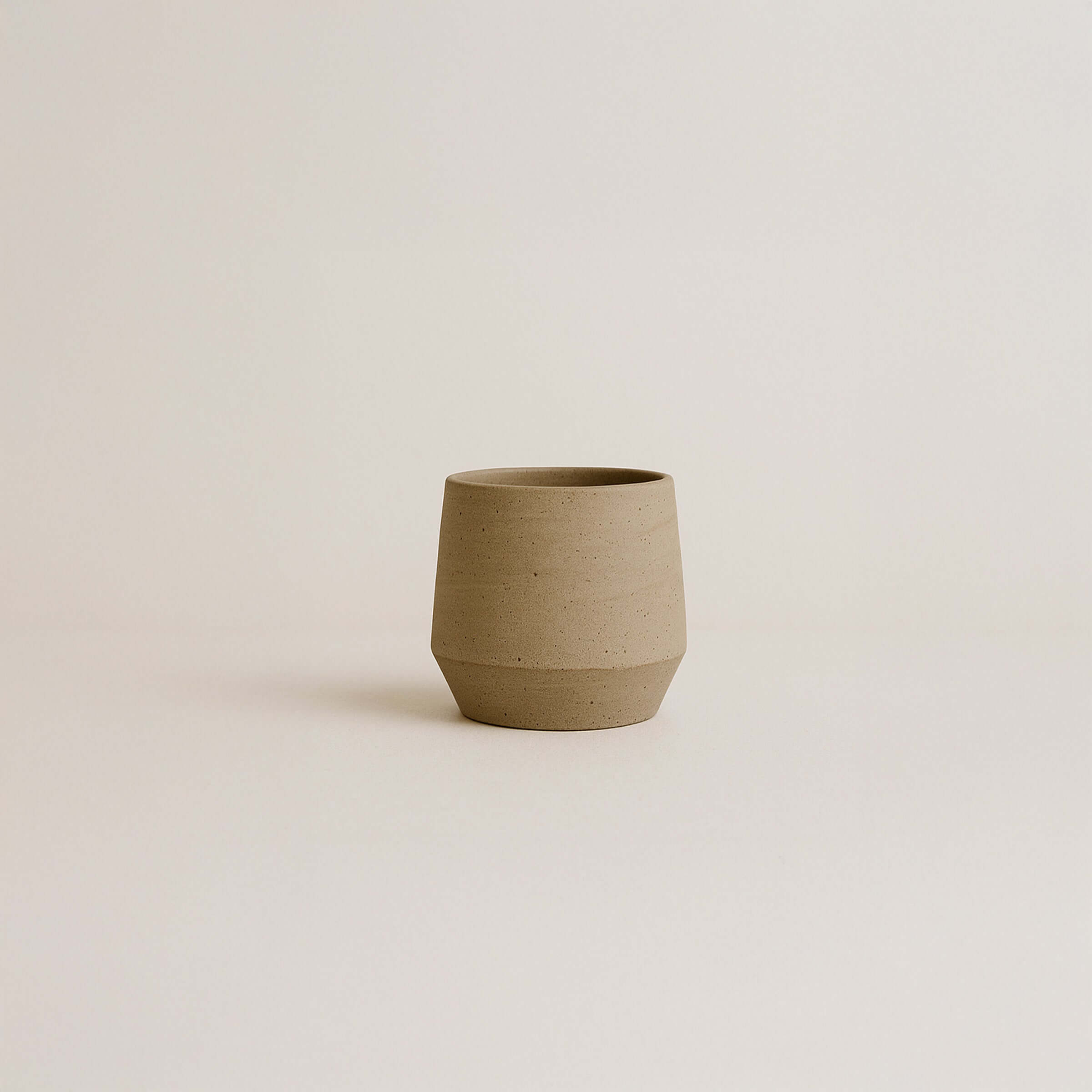 Unique stoneware wine cup from Weingut Baumberger, featuring groggy surfaces and glossy interior glaze.