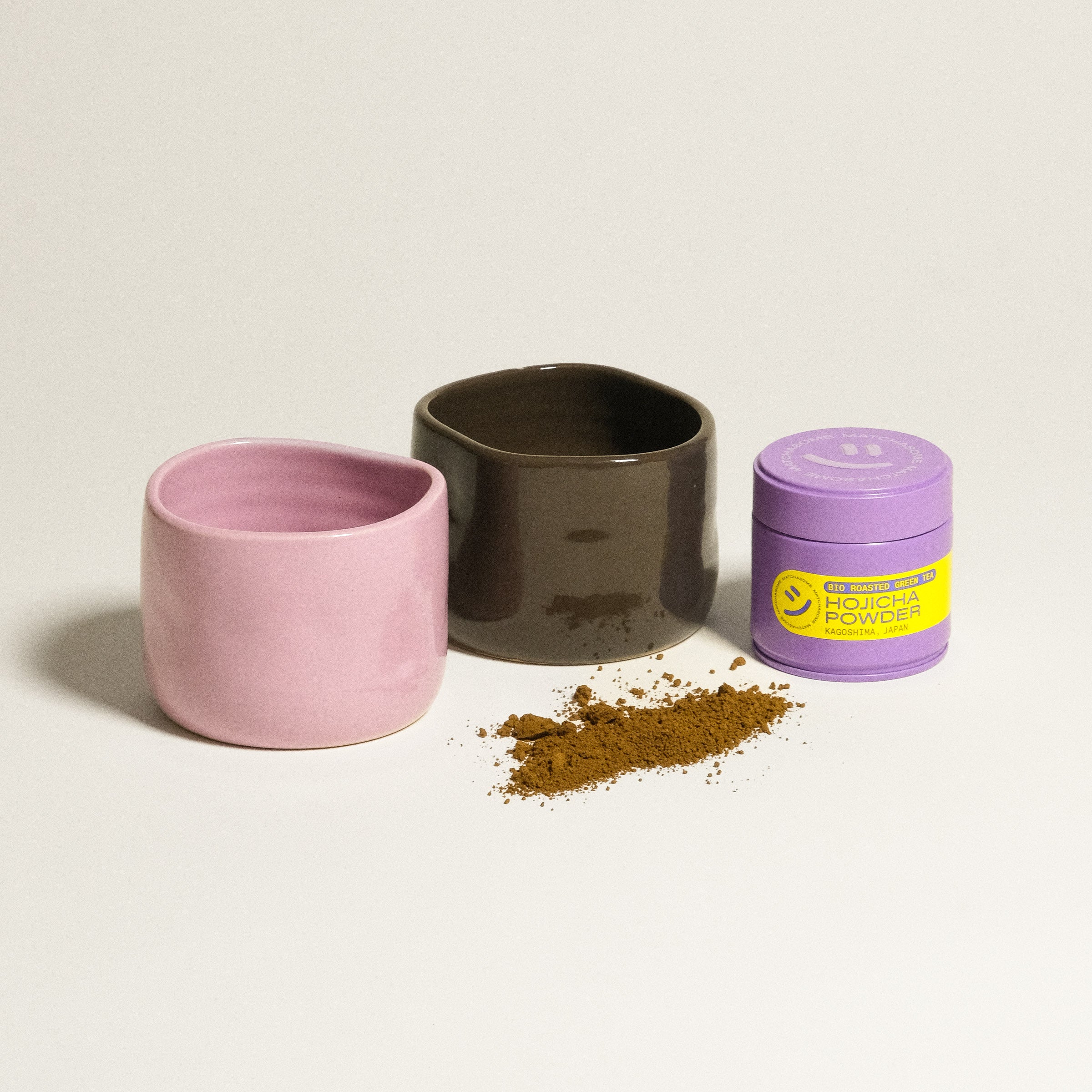 Hojicha Set - 2 Cups & Hojicha Tin 30g *COMING SOON* featuring handmade pink and brown cups with Hojicha powder.