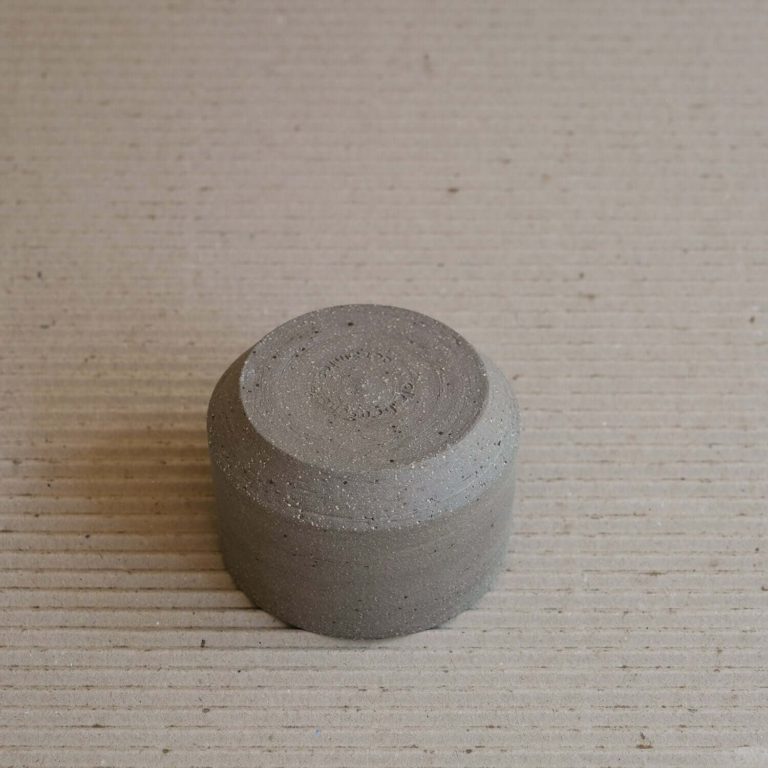 Terroir Cup, stoneware with unique groggy surfaces and stone inclusions, handmade from brown clay.