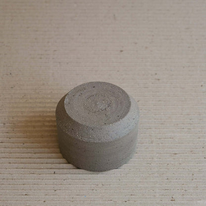 Terroir Cup, stoneware with unique groggy surfaces and stone inclusions, handmade from brown clay.