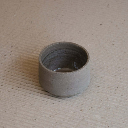 Stoneware Terroir Cup with brown clay, glossy interior glaze, and raw exterior texture.