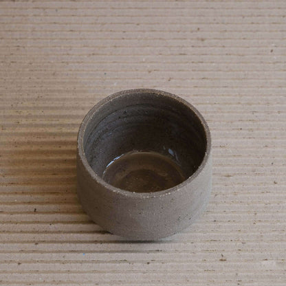 Unique Terroir Cup made from brown clay, featuring a glossy interior glaze and raw exterior texture.