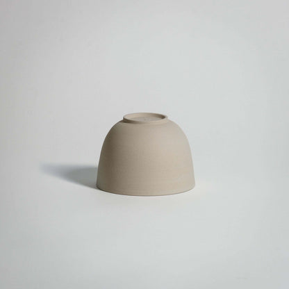 Handcrafted stoneware tea cup Yun in a soft beige tone, showcasing a minimalist design and natural ceramic beauty.