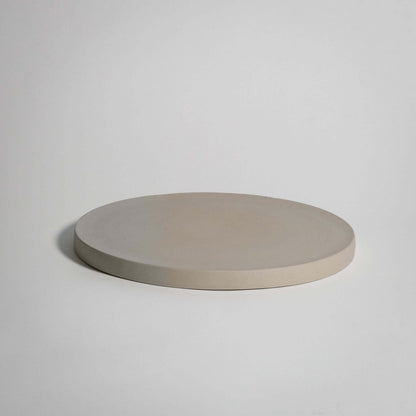 Handcrafted unique dinner plate in creme, made of durable stoneware ceramic with a natural finish.
