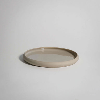 Bistro Lunch Plate in creme, handcrafted stoneware ceramic with a glossy glaze; food-safe, durable, versatile for oven or dishwasher.