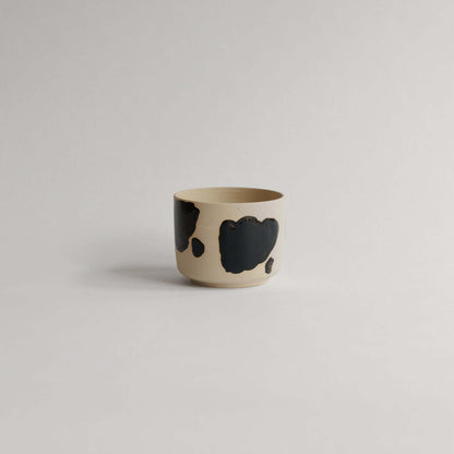 Shop the Nomi Pepe Coffee Cup, a VBC classic. 170 ml of handmade charm with unique glossy black brush strokes. Each piece is one-of-a-kind! from viola beuscher ceramics