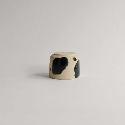 Shop the Nomi Pepe Coffee Cup, a VBC classic. 170 ml of handmade charm with unique glossy black brush strokes. Each piece is one-of-a-kind! from viola beuscher ceramics