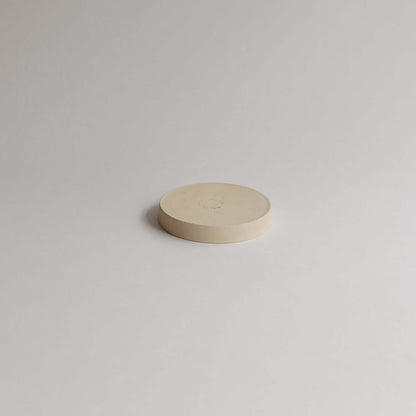 Unique 10cm Mini Dish Creme made of grey stoneware with glossy glaze. Perfect for food, lovingly handcrafted for a distinct touch to your table. von viola beuscher ceramics