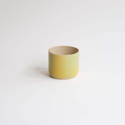 Eye-catching Bloom Cup with vibrant spray-painted design. Perfect size for your coffee delight. Artisanal charm in every sip! from viola beuscher ceramics