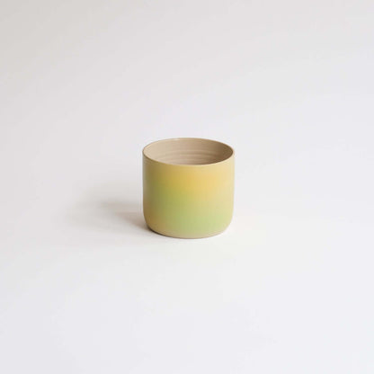 Eye-catching Bloom Cup with vibrant spray-painted design. Perfect size for your coffee delight. Artisanal charm in every sip! from viola beuscher ceramics