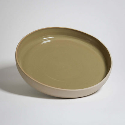 A very big Serving Plate with high rims. Outside is no glazing and inside is a MOSS glazing.