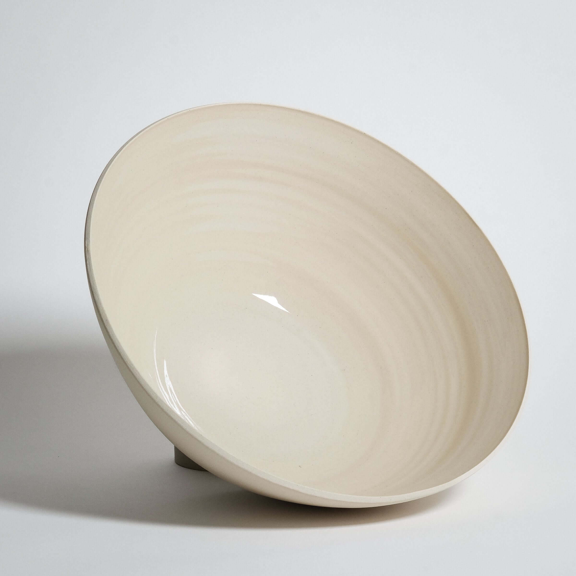 Handmade Yun Creme serving bowl in high-quality stoneware with glossy glaze, perfect for oven and dishwasher use.