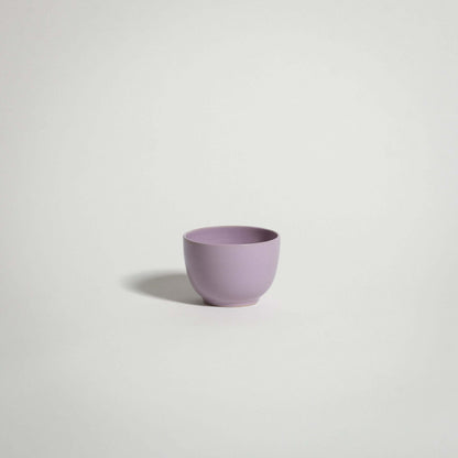 Handcrafted stoneware espresso cup in lilac glaze, perfect for everyday use and dishwasher safe.