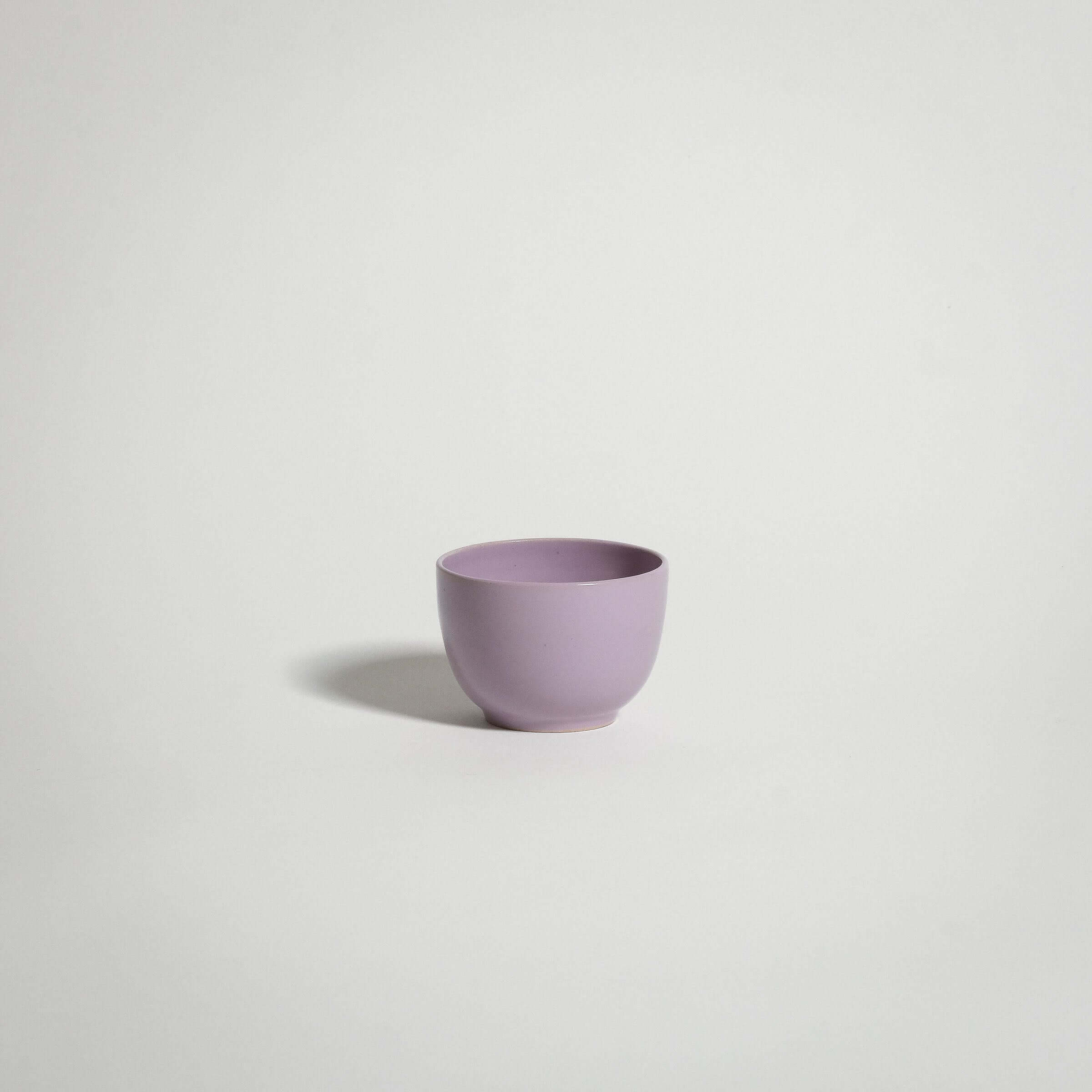 Lilac wheel-thrown espresso cup from the Yun Trio, fully glazed for a stylish and elegant coffee experience.