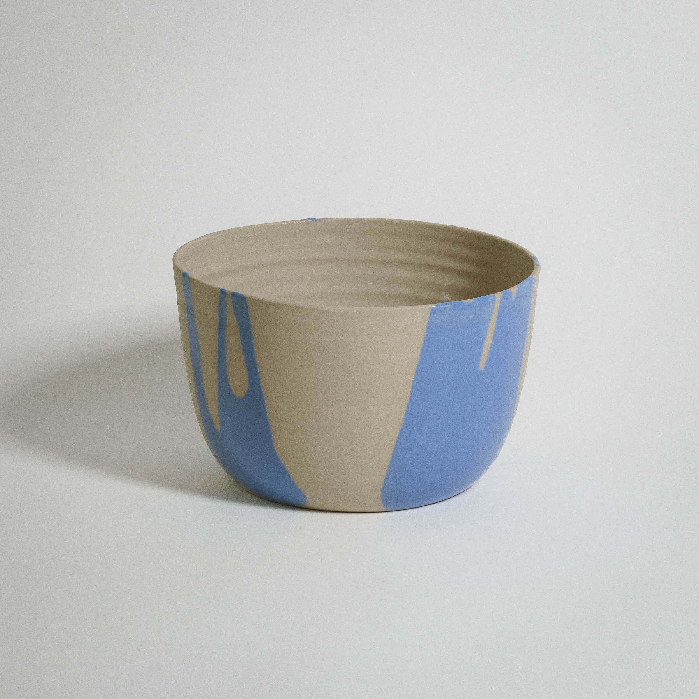 Splash Planter Blue, handmade stoneware ceramic with light blue glaze, unique and food-safe planter for stylish decor.