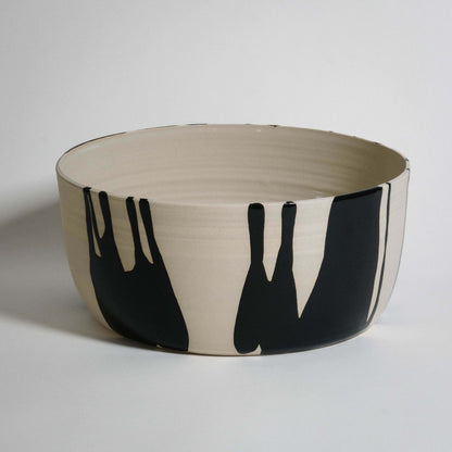 Handmade wide serving bowl crafted from stoneware with black and beige design, featuring smooth glossy glaze finish.