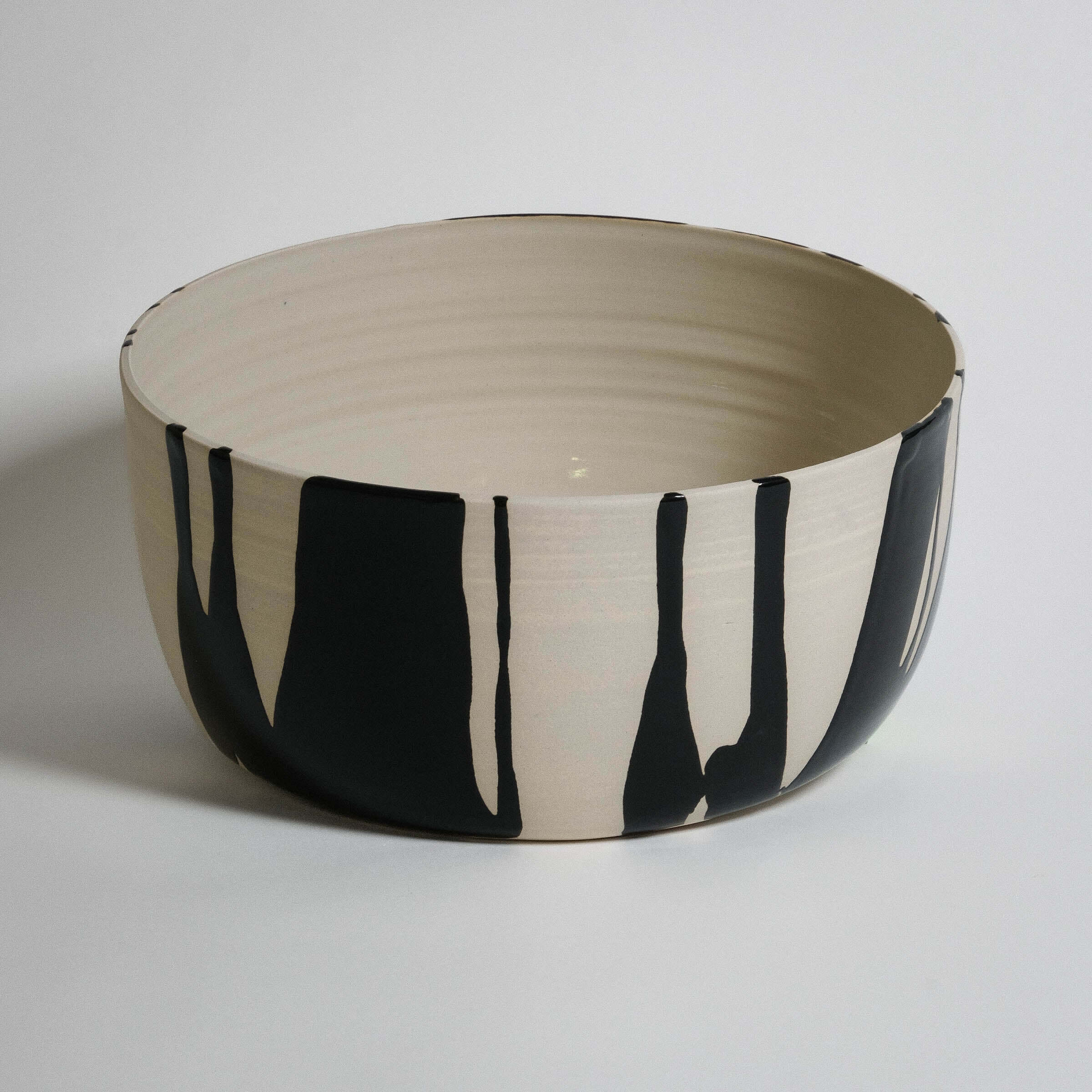 Handmade Otis wide serving bowl in stoneware with black and white glaze, perfect for parties and daily use.