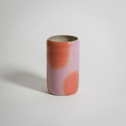 Pink and orange medium vase No2 made from grey stoneware with glossy glaze and airbrushed color dots.