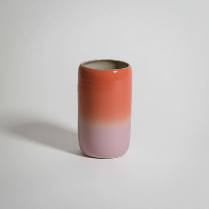Gradient medium vase in grey stoneware with glossy glaze and airbrushed orange-pink gradient.