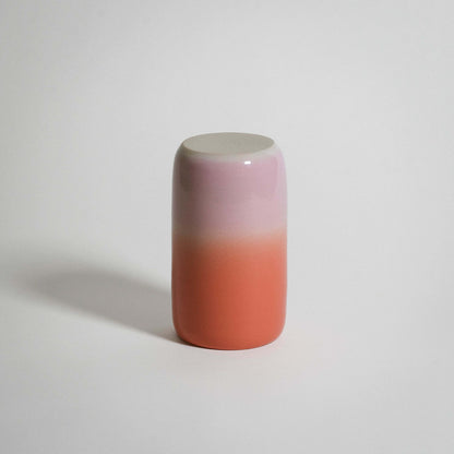 Gradient medium vase in pink and orange, made from grey stoneware clay with a glossy finish.