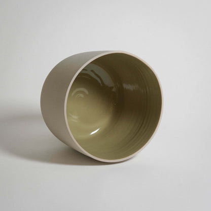 Medium planter in moss green glaze, crafted from durable stoneware ceramic, showcasing a unique and elegant design.
