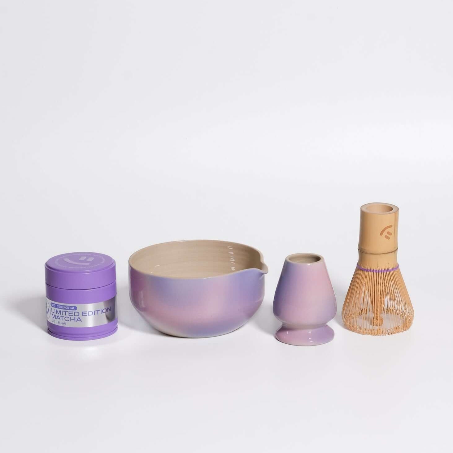 Matcha set including a matcha bowl, whisk holder, matcha whisk, and Uji matcha in a purple gradient design.