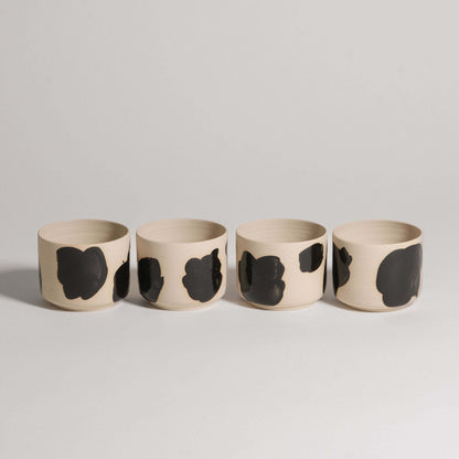 Set of 4 Nomi Pepe coffee cups, wheel-thrown grey stoneware with glossy black brush strokes.