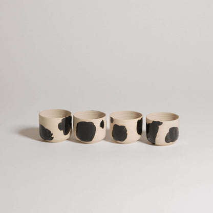 Set of 4 Nomi Pepe espresso cups in grey stoneware with hand-painted black brush strokes.