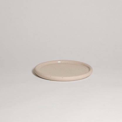 Lunch plate in spotted clay, wheel-thrown stoneware with a gently concave shape, food safe and dishwasher safe.