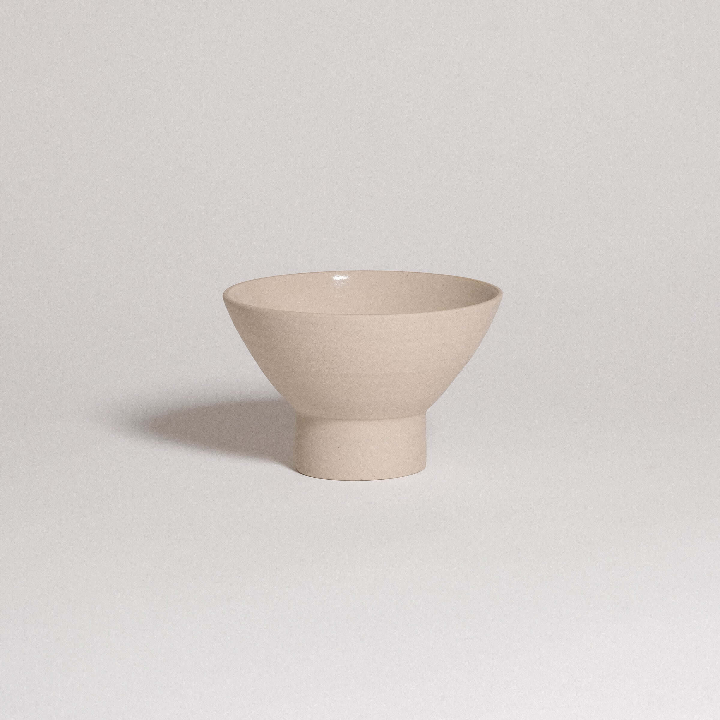 Small beige dessert bowl with sculptural shape, matte finish, suitable for desserts and side dishes, made in Frankfurt.