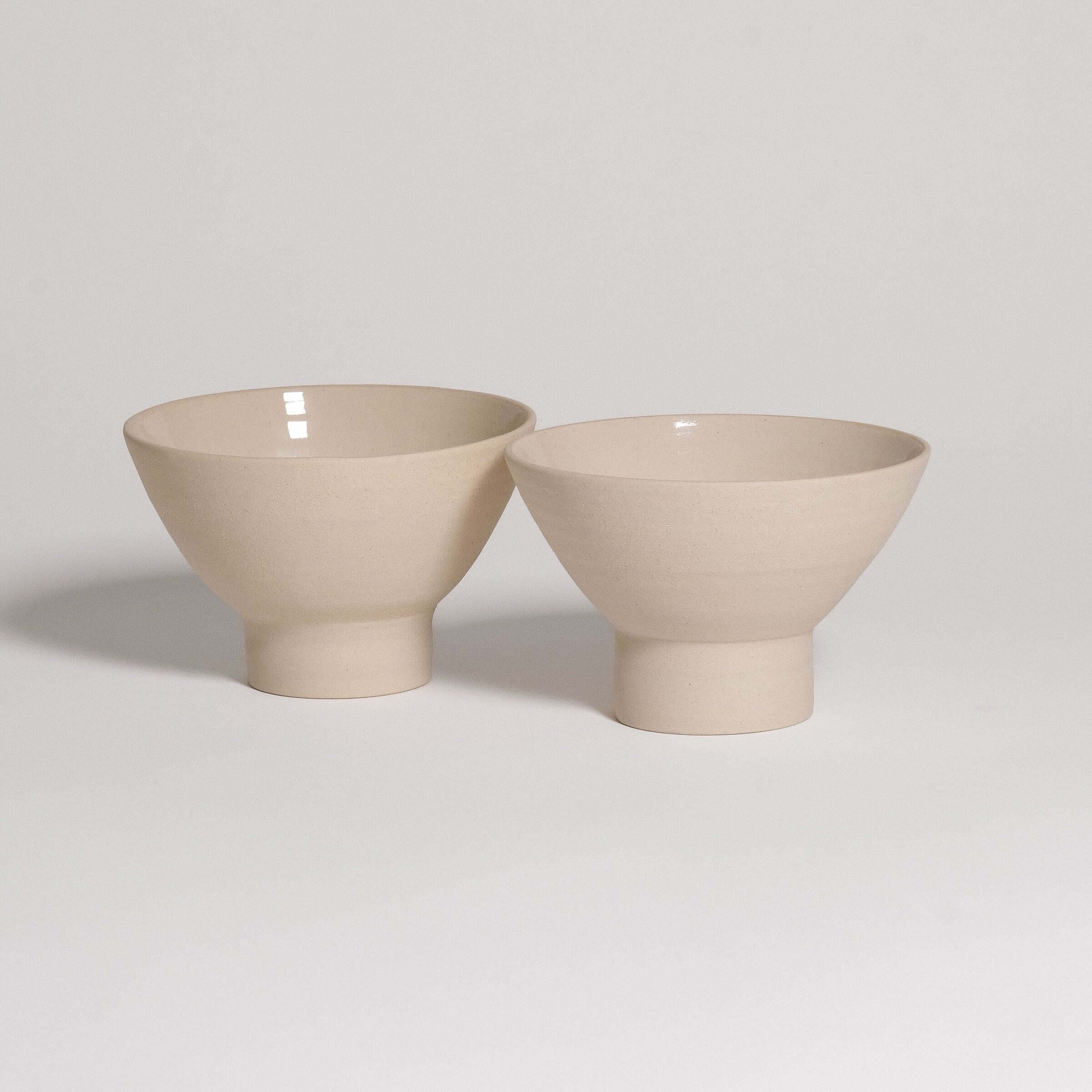 Small dessert bowls in matte beige with sculptural design, perfect for desserts or side dishes. Dishwasher safe.